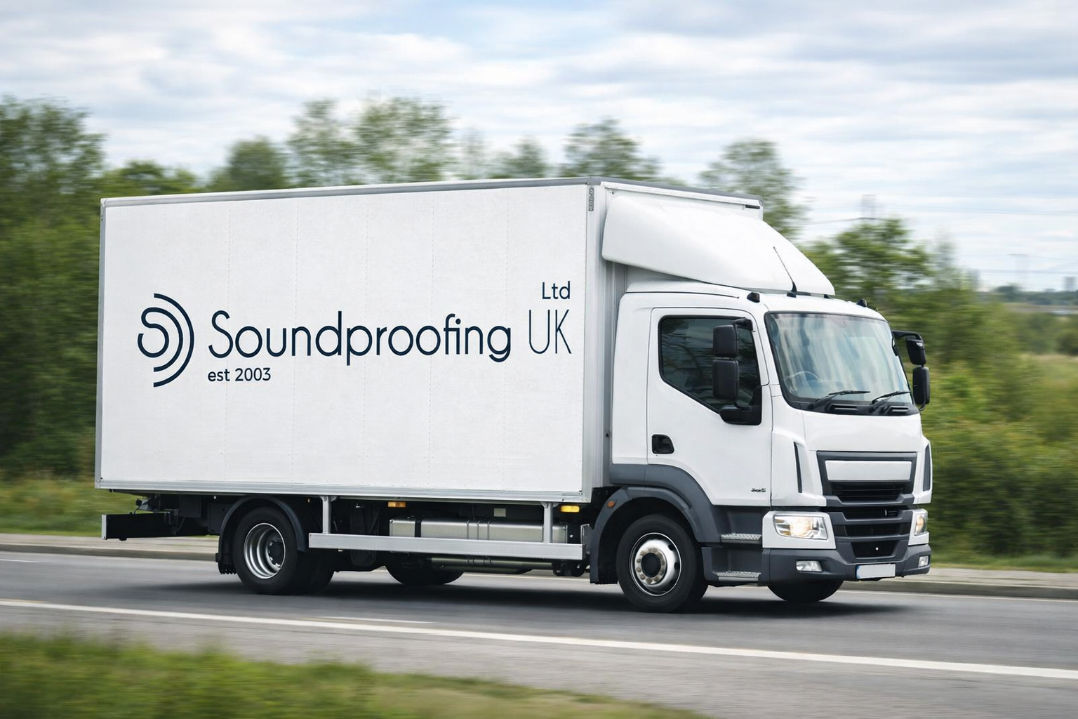 Branded soundproofing company truck, representing mobile installation and acoustic insulation services.